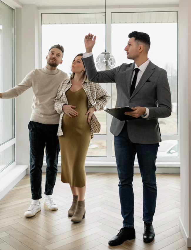 real estate appraiser showing the property to a couple rome ga